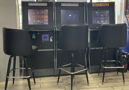 A set of skill game machines line the windows inside a Kentucky gas station. The games were banned in the state in the summer of 2023 (Photo Credit: Joce Sterman, InvestigateTV)
