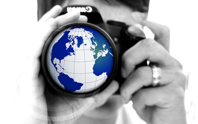 A graphic of a globe in a camera lens.