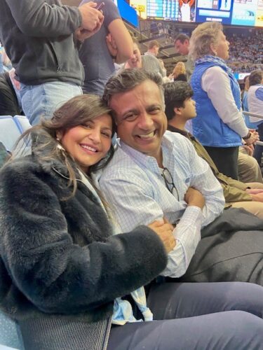 Dr. Henry Patel and his wife, Shital, attend a basketball game before his passing in 2020.
