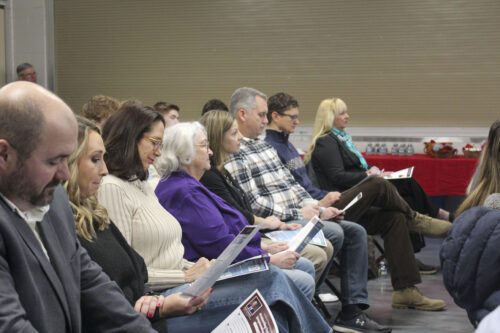 Boone County residents read a list of priorities from their local legislators at the Boone County Legislative Breakfast at the Boone County Fairgrounds on Feb. 1, 2025. (Mia Hilkowitz/Arnolt Center for Investigative Journalism)