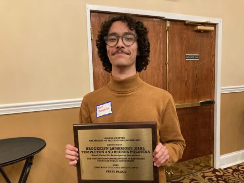 Center reporter Karl Templeton holds the first place award he won with Brookelyn Lambright and Brenna Polovina during the Indy SPJ award ceremony Friday, May 2, 2025. (Photo by Anne Kibbler)