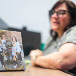 A canvas photo from a family vacation is seen on Emily Meyer’s desk March 27, 2025, in her office at the Dubois County Community Corrections Center in Jasper, Indiana. This was the only vacation Meyer had taken with her children. (Photo by Alayna Wilkening)