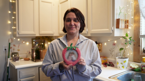 Alisha Ladyga holds a photo of her girls. “I don't regret that I was sent to prison because it saved me. It saved my kids," she said.