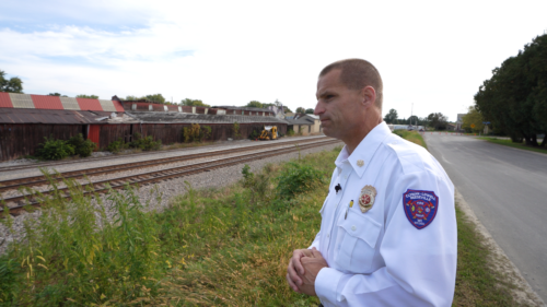 CLR Fire & Rescue Chief Eric Howlett looks out at the tracks near Reeseville, Wisconsin that have seen two derailments in just over two years.(Scotty Smith, InvestigateTV)