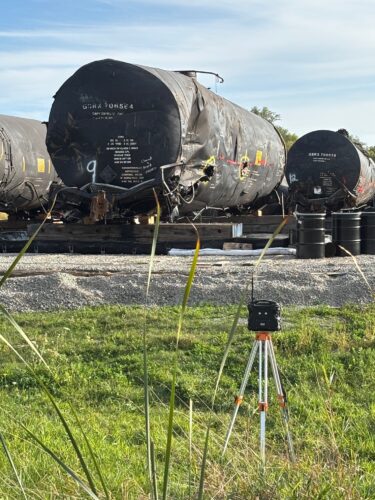A tanker damaged in an August derailment in Reeseville, Wisconsin, sits lined up with other rail cars just down the road from the accident site.(Joce Sterman, InvestigateTV)