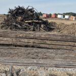 Debris from the August derailment near Reeseville, Wisconsin, sits in tangled piles just off the tracks.