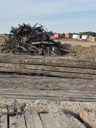 Debris from the August derailment near Reeseville, Wisconsin, sits in tangled piles just off the tracks.